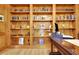 Close up of the home office bookshelf with books and decor items at 155 Woodcreek Ln, Fayetteville, GA 30215