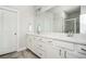 Bright bathroom featuring double sinks and a large mirror at 2026 Forte Ln, Alpharetta, GA 30009