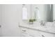Bathroom with marble countertop, a mirror, and white cabinets offers comfort and convenience at 2026 Forte Ln, Alpharetta, GA 30009