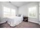 Bedroom featuring a bed, carpet flooring and natural light, creating a comfortable personal space at 2026 Forte Ln, Alpharetta, GA 30009