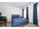 Bedroom with blue bedding, carpet flooring and natural light, provides a restful haven at 2026 Forte Ln, Alpharetta, GA 30009
