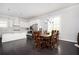 Open concept dining room and kitchen with dark hardwood flooring and modern lighting at 2026 Forte Ln, Alpharetta, GA 30009