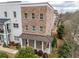 Lovely exterior view of the brick townhouse and inviting covered front porch at 2026 Forte Ln, Alpharetta, GA 30009