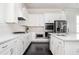 Bright kitchen with stainless steel appliances, white cabinets and marble countertops provides a great cooking space at 2026 Forte Ln, Alpharetta, GA 30009