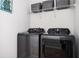 Laundry room with modern washer and dryer units, designed for efficient and convenient chore management at 2026 Forte Ln, Alpharetta, GA 30009