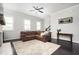 Spacious living room featuring a fireplace, dark hardwood floors and an area rug at 2026 Forte Ln, Alpharetta, GA 30009