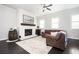 Bright living room with a fireplace, large windows and stylish decor at 2026 Forte Ln, Alpharetta, GA 30009