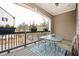 Inviting covered patio with dining set, flowers, and neighborhood views at 2026 Forte Ln, Alpharetta, GA 30009