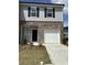 Modern two-story home featuring a brick facade, single-car garage, and manicured lawn at 3017 Acacia Cir, Douglasville, GA 30135