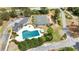 An aerial view showcasing a community that features a pool and tennis court at 2503 Westchester Se Way, Conyers, GA 30013