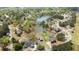An aerial view displaying a community featuring homes surrounding a serene lake at 2503 Westchester Se Way, Conyers, GA 30013