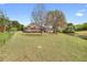 Spacious backyard featuring a well-maintained lawn and a view of the home's rear exterior at 2503 Westchester Se Way, Conyers, GA 30013