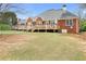 Spacious brick home featuring a wooden deck perfect for outdoor entertaining at 2503 Westchester Se Way, Conyers, GA 30013