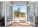 Private balcony with wooden deck and railing accessible from bedroom at 2503 Westchester Se Way, Conyers, GA 30013