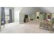 Bright bonus room features sloped ceilings, carpet floors, and a comfortable seating area at 2503 Westchester Se Way, Conyers, GA 30013
