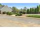 Landscaped community entrance with gate and manicured shrubbery at 2503 Westchester Se Way, Conyers, GA 30013