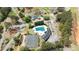 Aerial view of a community pool, tennis court, and surrounding upscale homes at 2503 Westchester Se Way, Conyers, GA 30013
