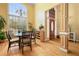 Bright dining area with large windows, hardwood floors, and a decorative chandelier, perfect for meals at 2503 Westchester Se Way, Conyers, GA 30013