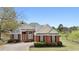Charming two-story brick home with manicured lawn and mature trees, offering classic curb appeal at 2503 Westchester Se Way, Conyers, GA 30013