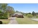 Inviting two-story brick home with manicured lawn and curved driveway at 2503 Westchester Se Way, Conyers, GA 30013