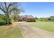 Beautiful two-story brick home with lush front lawn and long, curved driveway at 2503 Westchester Se Way, Conyers, GA 30013