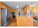 Spacious kitchen featuring wood cabinets, stainless steel appliances, and open layout at 2503 Westchester Se Way, Conyers, GA 30013