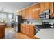 Well-lit kitchen with wood cabinets, stainless steel appliances, and modern design at 2503 Westchester Se Way, Conyers, GA 30013