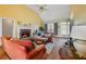 Stylish living room with hardwood floors, a fireplace, and large windows, creating a warm and welcoming atmosphere at 2503 Westchester Se Way, Conyers, GA 30013