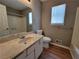Bathroom with large mirror, vanity and a combined shower and tub at 3512 Ten Oaks Ct, Powder Springs, GA 30127