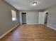 Cozy bedroom features a closet, sleek hardwood floors, and a window at 3512 Ten Oaks Ct, Powder Springs, GA 30127