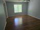 Bedroom with hardwood floors, natural lighting and fresh blue walls at 3657 Willow Wood Way, Lawrenceville, GA 30044