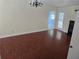 Dining area with wooden flooring, a modern chandelier, and natural lighting at 3657 Willow Wood Way, Lawrenceville, GA 30044
