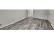 Neutral bedroom with gray wood-look floors and ample natural light at 4193 Port Chester Way, Decatur, GA 30034