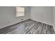 Bedroom featuring durable gray laminate flooring and neutral paint for a modern clean look at 4193 Port Chester Way, Decatur, GA 30034