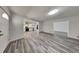 Bright open-concept living area with wood-look floors connects the kitchen and living spaces at 4193 Port Chester Way, Decatur, GA 30034