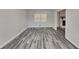 Spacious living room featuring modern gray wood-look floors and natural light at 4193 Port Chester Way, Decatur, GA 30034