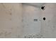 Bathroom shower featuring white marble-look tile and pebble shower floor at 4193 Port Chester Way, Decatur, GA 30034