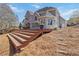 Backyard deck with an outdoor seating area that overlooks the peaceful wooded backyard at 1130 Martins Chapel Rd, Lawrenceville, GA 30045