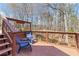 Deck with seating overlooks wooded backyard and pond at 1130 Martins Chapel Rd, Lawrenceville, GA 30045