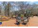 Backyard deck with seating area and a swing with views of the surrounding trees at 1130 Martins Chapel Rd, Lawrenceville, GA 30045