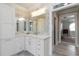 Bright bathroom with double vanity, granite countertop, and decorative mirror with lighting at 1130 Martins Chapel Rd, Lawrenceville, GA 30045