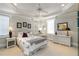 Bright bedroom with neutral tones, white wicker furniture and decor, plus tray ceiling detail and plenty of natural light at 1130 Martins Chapel Rd, Lawrenceville, GA 30045