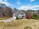 An aerial view of a beautiful estate with lush landscaping and a long private driveway at 1130 Martins Chapel Rd, Lawrenceville, GA 30045