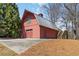 Detached two-story barn garage with ample space and potential for various uses at 1130 Martins Chapel Rd, Lawrenceville, GA 30045
