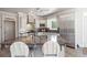 Modern kitchen with granite countertops, stainless steel appliances, and custom cabinets at 1130 Martins Chapel Rd, Lawrenceville, GA 30045