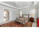 Well-lit main bedroom features carpet floors, decorative ceilings, and neutral paint at 1130 Martins Chapel Rd, Lawrenceville, GA 30045