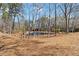 Scenic pond view surrounded by tall trees and natural landscape creating a peaceful, outdoor space at 1130 Martins Chapel Rd, Lawrenceville, GA 30045