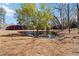 Backyard pond framed by lush greenery providing serene views and enhancing the property's appeal at 1130 Martins Chapel Rd, Lawrenceville, GA 30045