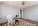 Cozy screened porch with a ceiling fan, table and chairs on wood flooring at 1130 Martins Chapel Rd, Lawrenceville, GA 30045