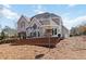 Home's large back deck offers stunning views of the wooded backyard at 1130 Martins Chapel Rd, Lawrenceville, GA 30045